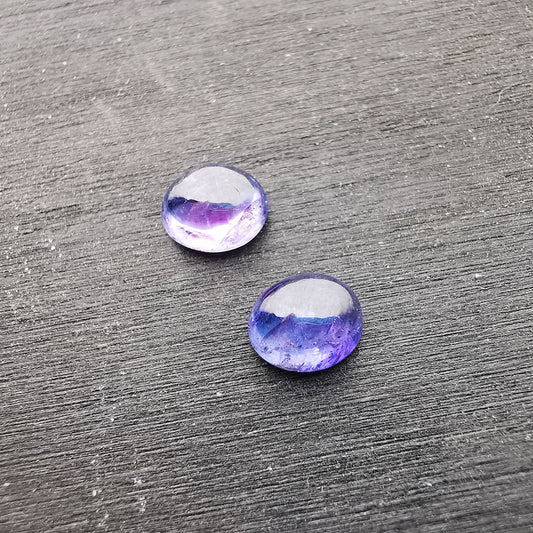 Coppia di Tanzaniti taglio ovale cabochon 2,23 ct